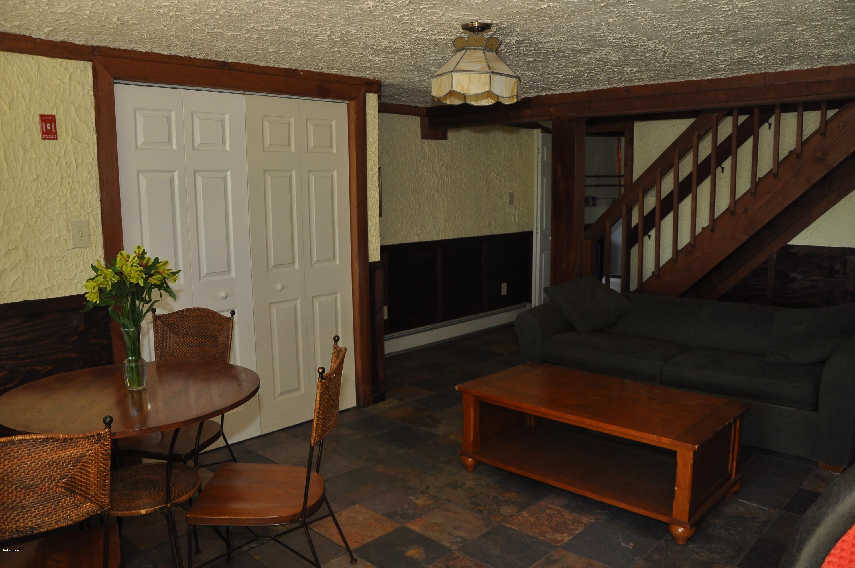462 East Otis Road Tolland, MA 01034 - Photo 27 of 29 a living room with furniture and a potted plant