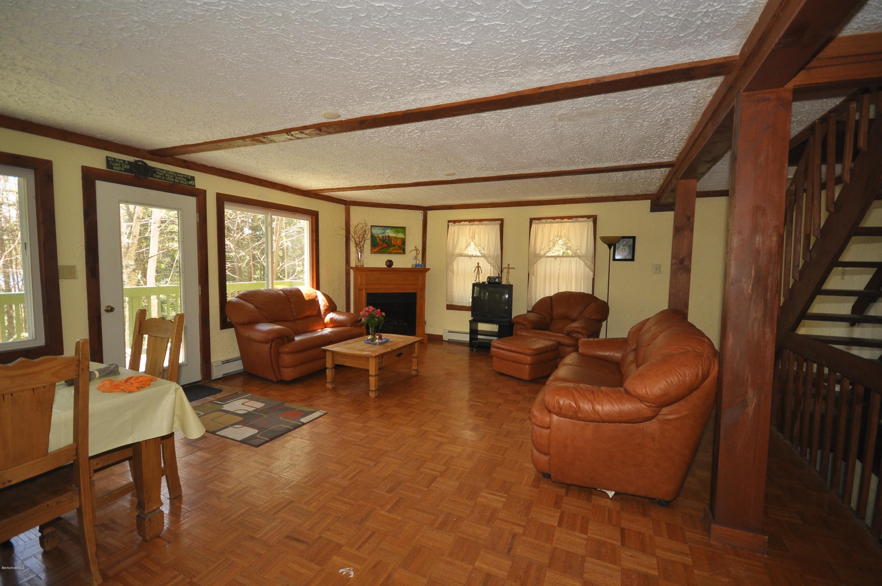 462 East Otis Road Tolland, MA 01034 - Photo 6 of 29 a living room with furniture floor to ceiling window and couch