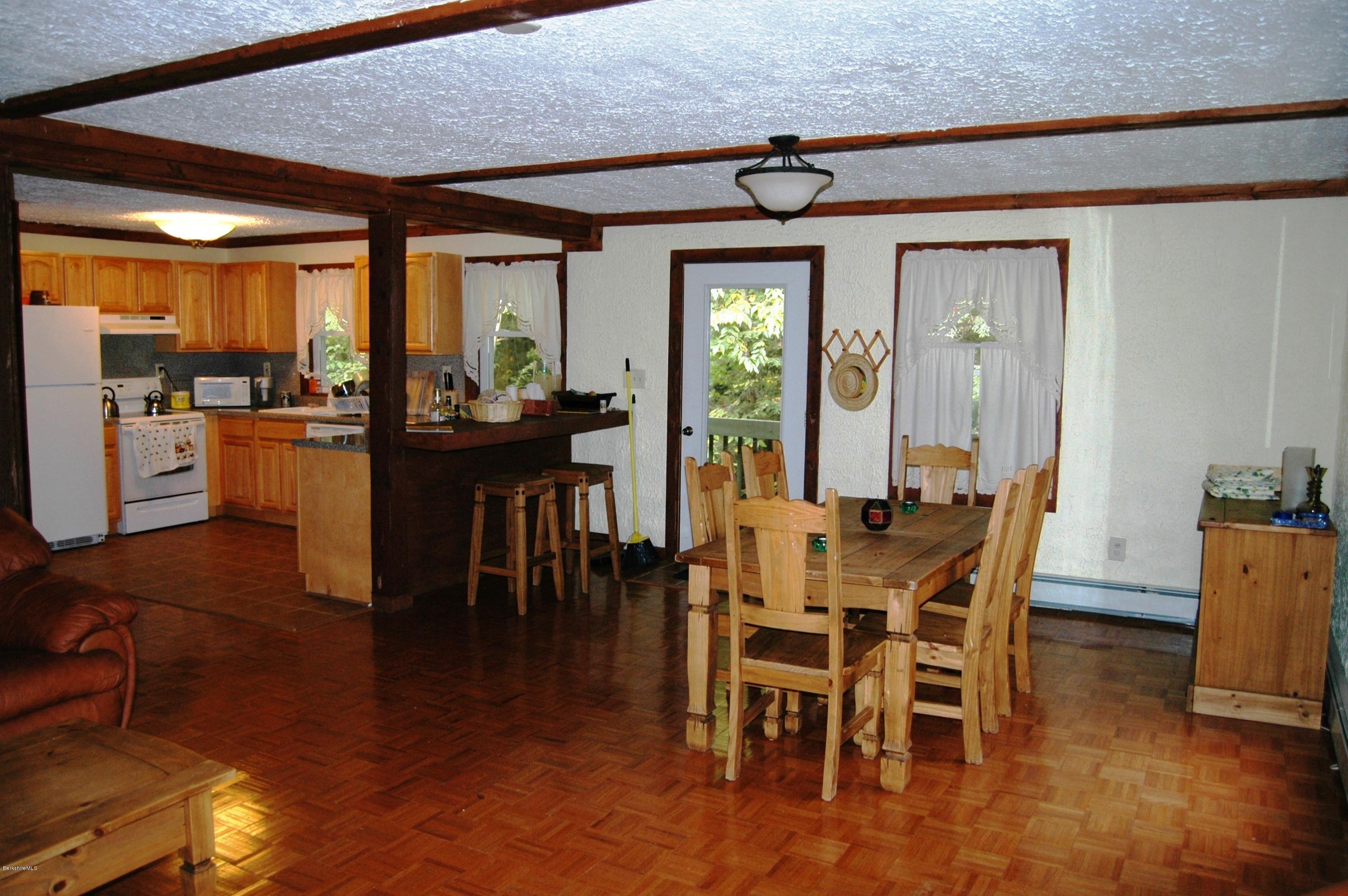462 East Otis Road Tolland, MA 01034 - Photo 8 of 29 a dining room with furniture window and wooden floor