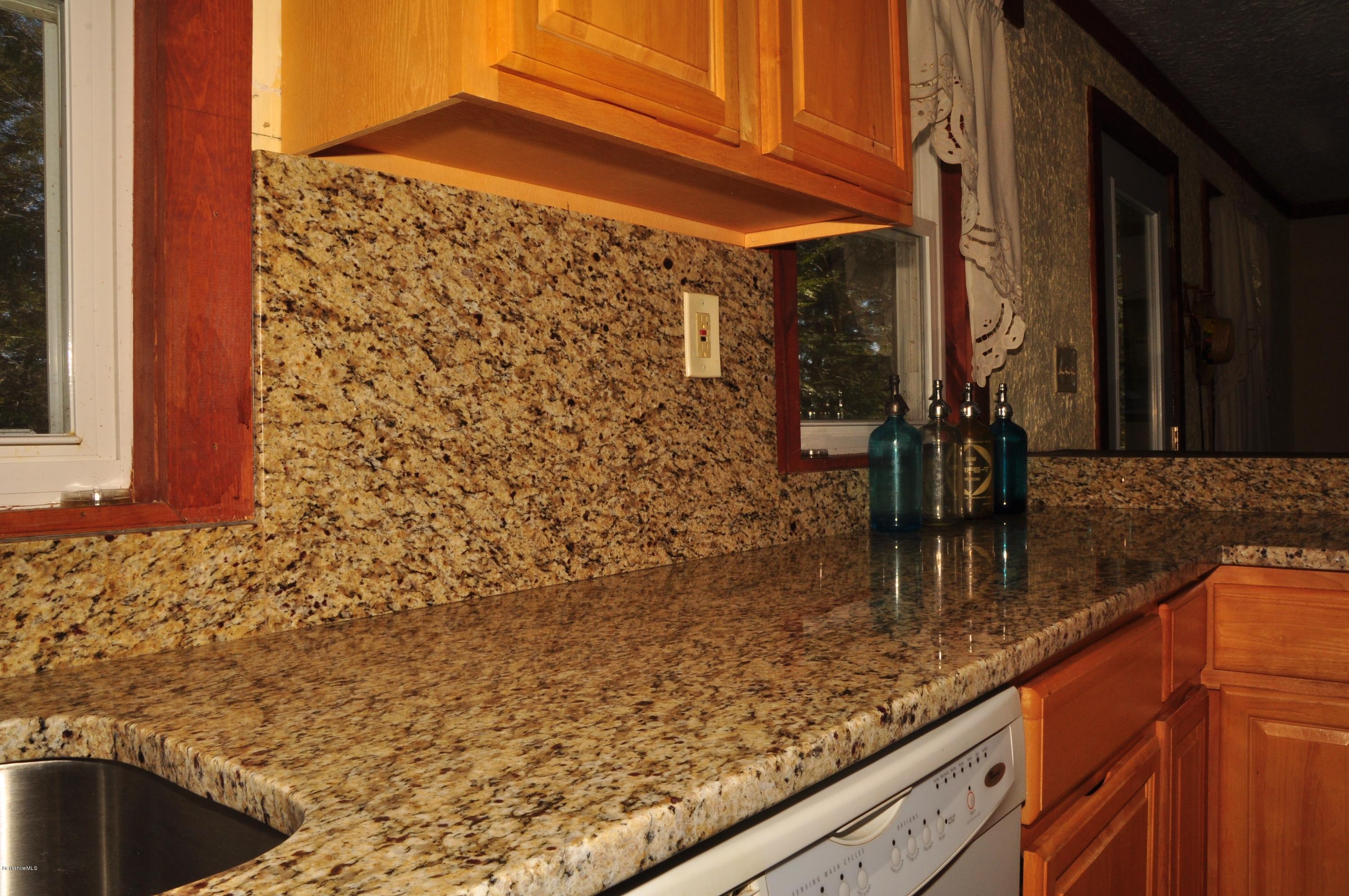 462 East Otis Road Tolland, MA 01034 - Photo 10 of 29 a kitchen with a sink and cabinets