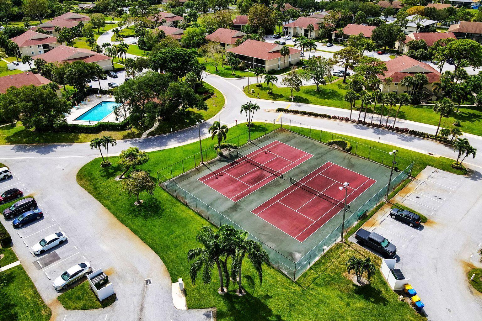 6572 Chasewood Drive, Unit E Jupiter, FL 33458 - Photo 23 of 23 an aerial view of a pool yard patio and outdoor seating