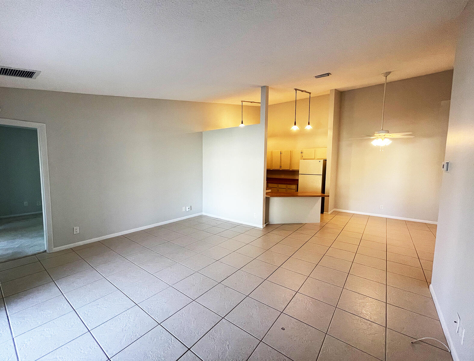 6572 Chasewood Drive, Unit E Jupiter, FL 33458 - Photo 10 of 23 a view of an empty room and window