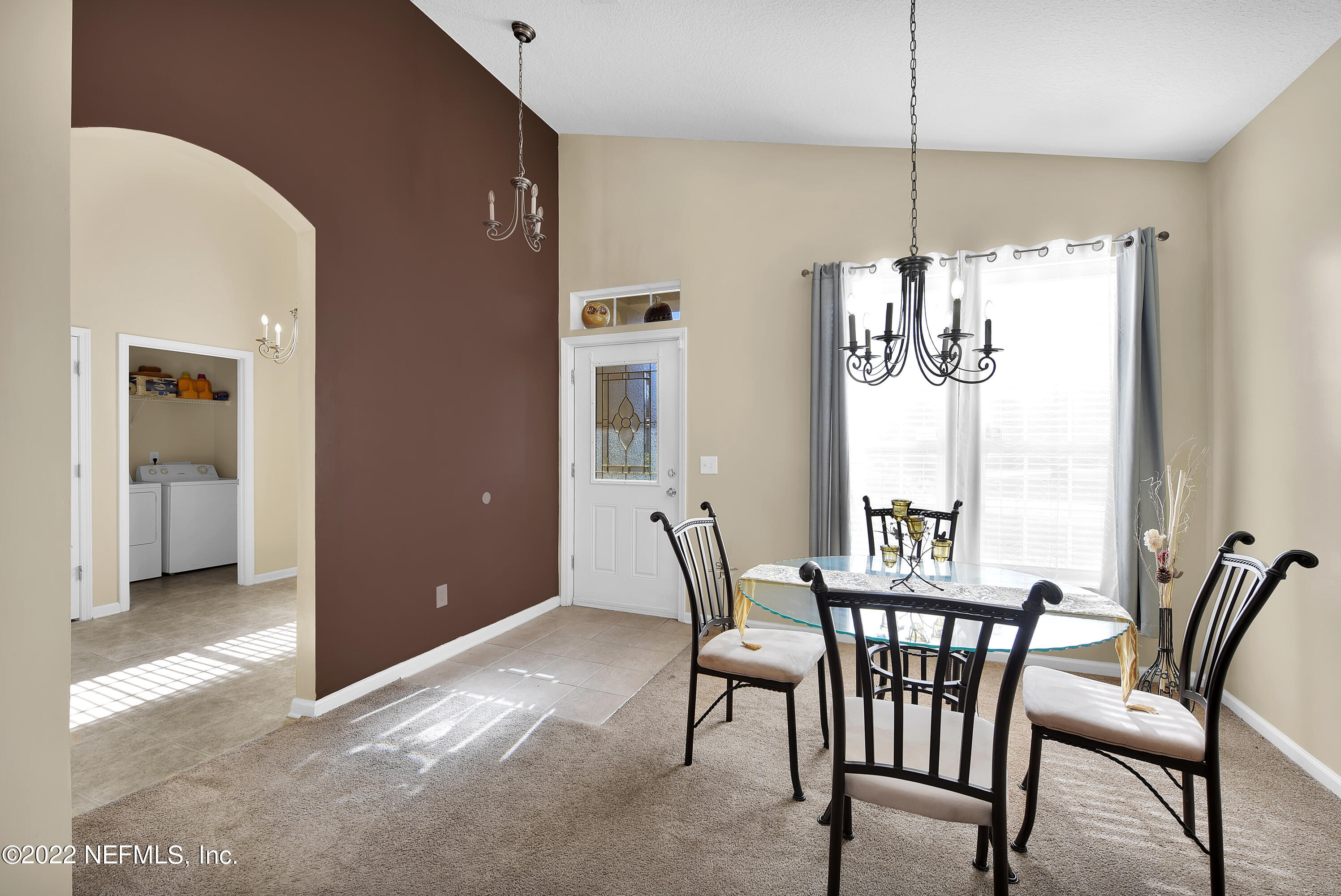 11941 Crooked River Road Jacksonville, FL 32219 - Photo 13 of 28 a view of a dining room with furniture window and wooden floor