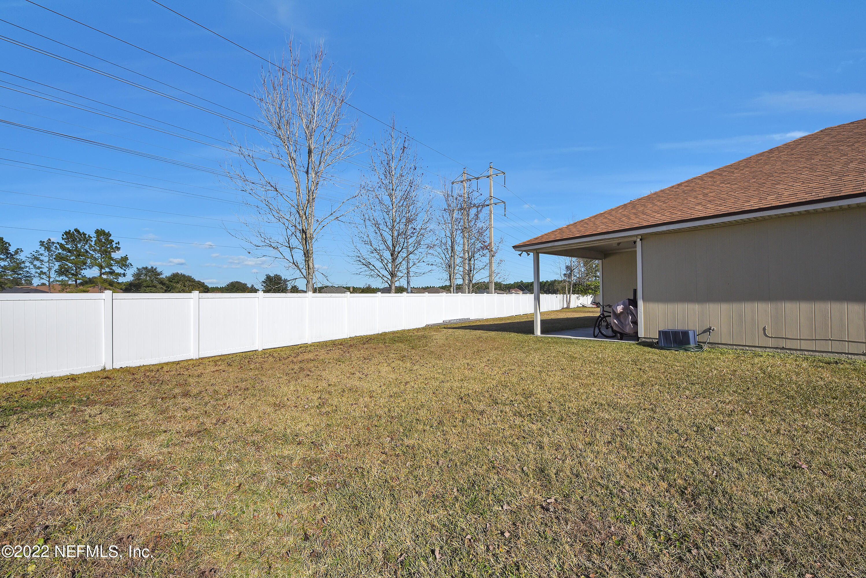 11941 Crooked River Road Jacksonville, FL 32219 - Photo 18 of 28 a view of backyard and tree