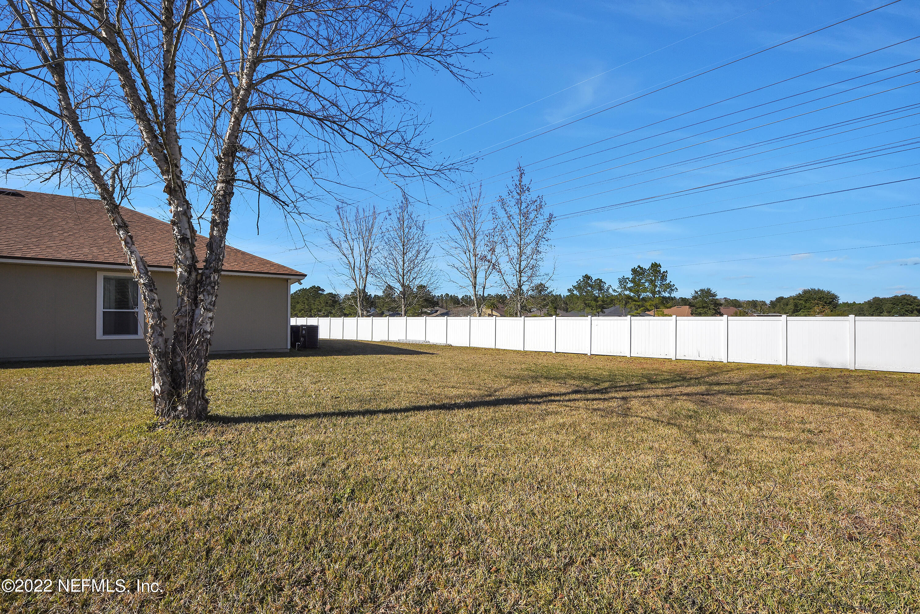 11941 Crooked River Road Jacksonville, FL 32219 - Photo 20 of 28 a view of a yard with a house