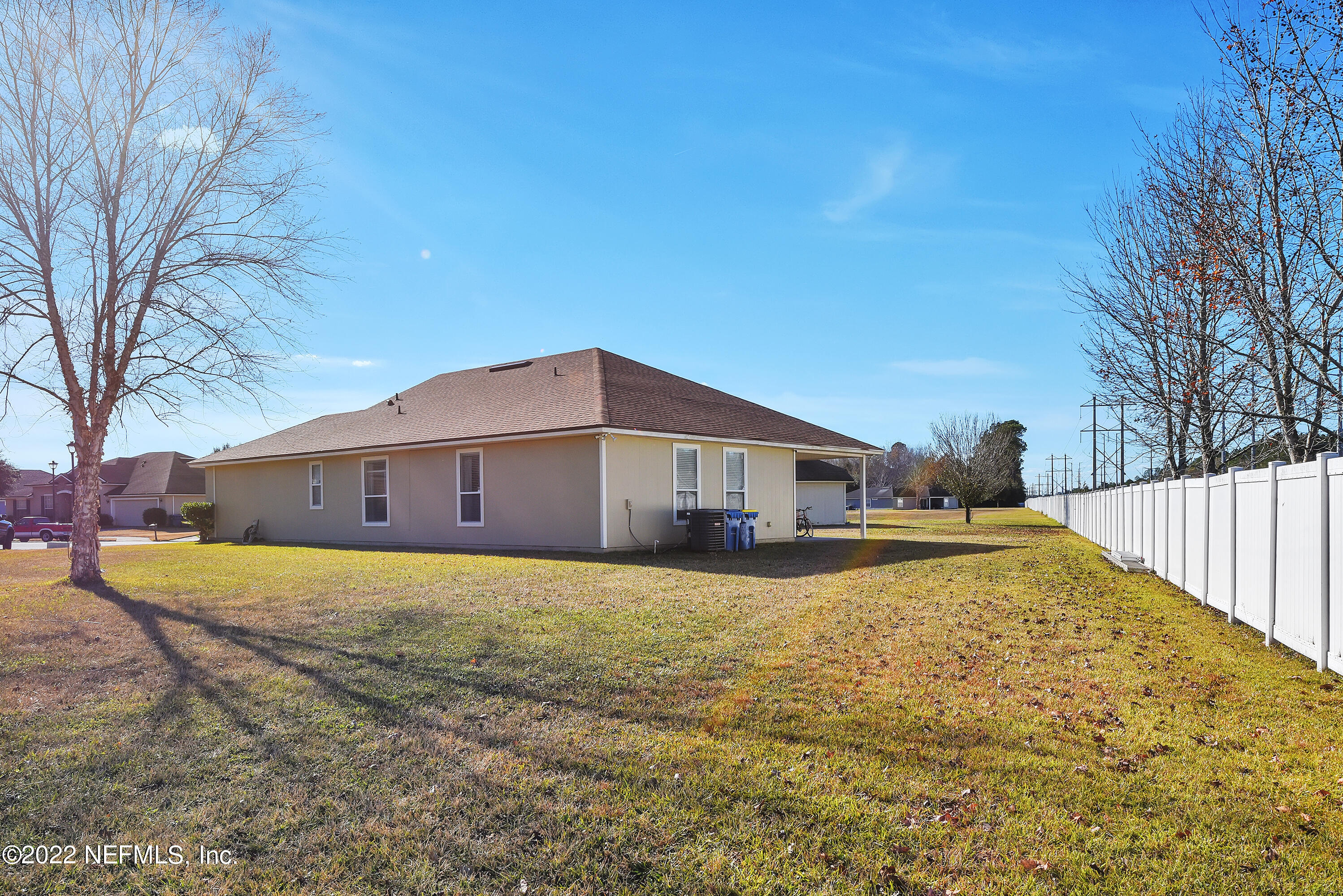11941 Crooked River Road Jacksonville, FL 32219 - Photo 21 of 28 a view of a house with a yard covered in snow