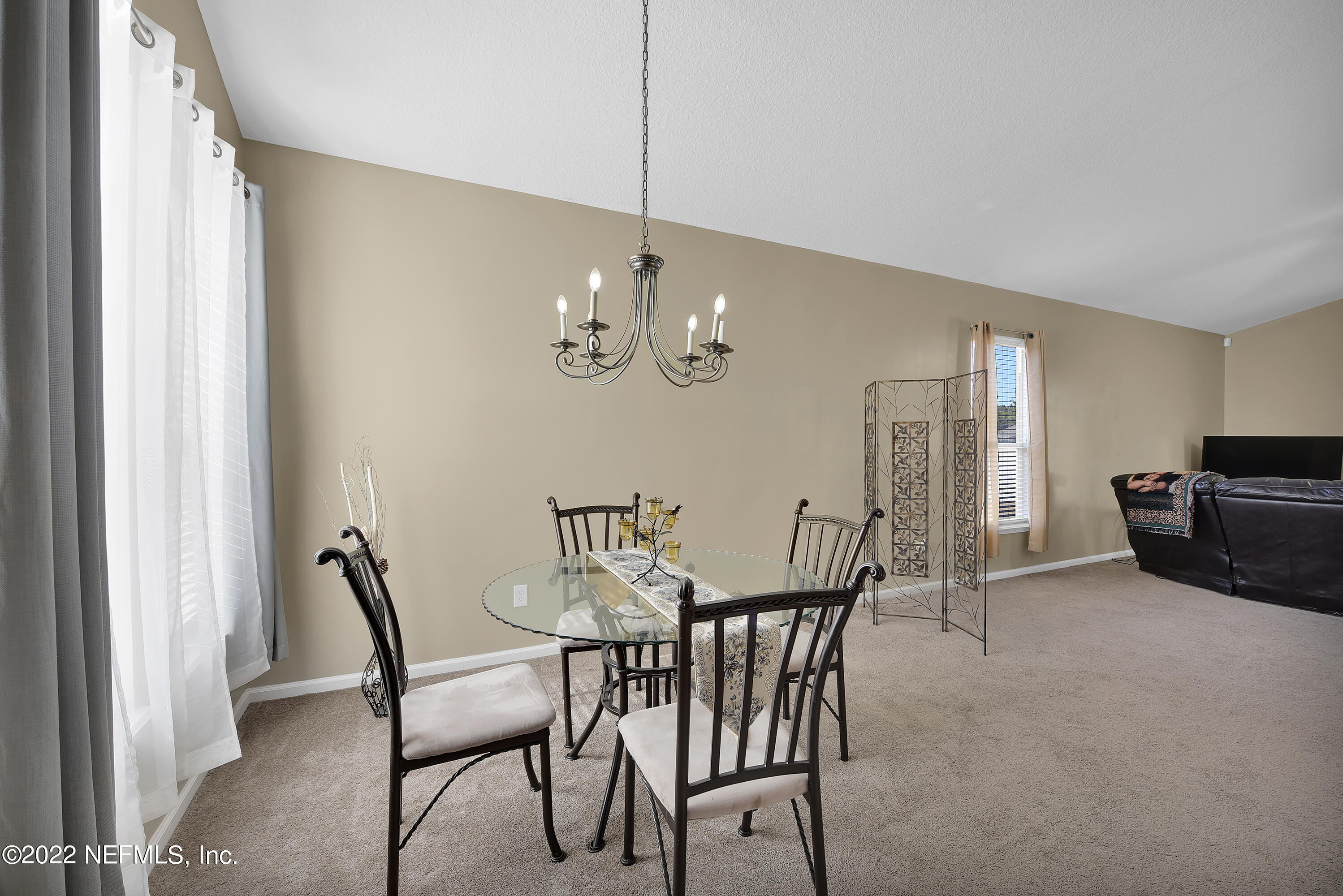 11941 Crooked River Road Jacksonville, FL 32219 - Photo 8 of 28 a view of a dining room with furniture and chandelier