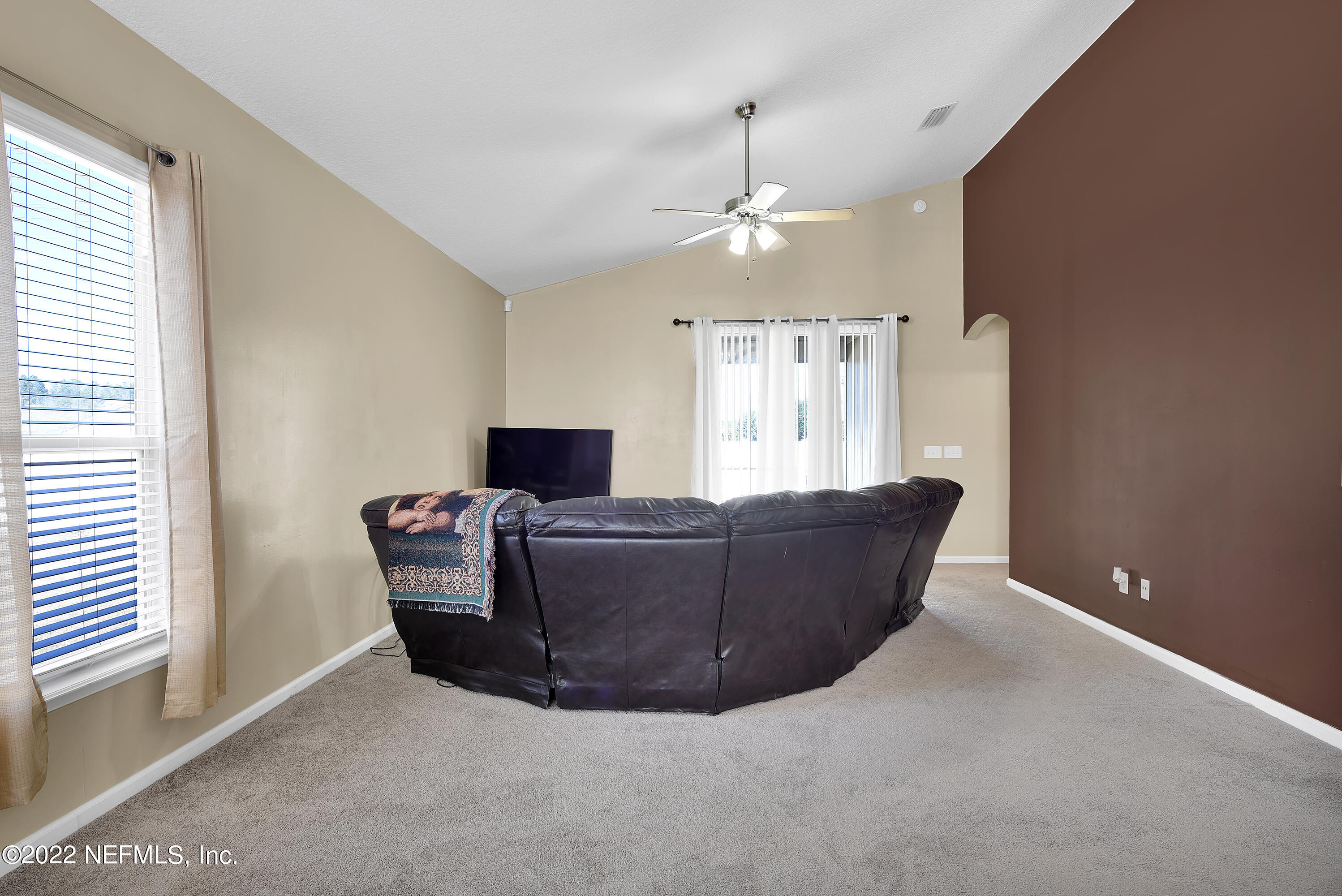 11941 Crooked River Road Jacksonville, FL 32219 - Photo 9 of 28 a living room with furniture and a window
