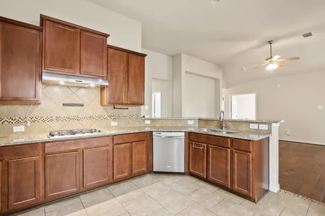 a kitchen with a sink and cabinets
