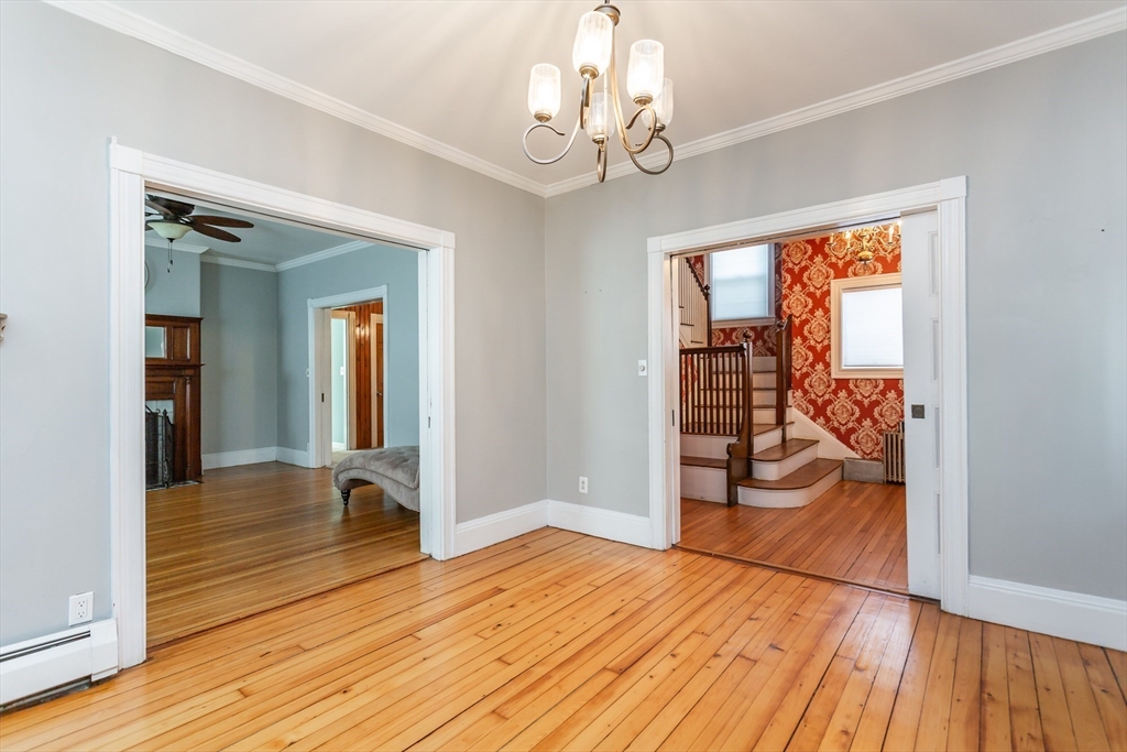 724 High Street Fall River, MA 02720 - Photo 13 of 39 a view of a livingroom with wooden floor and furniture