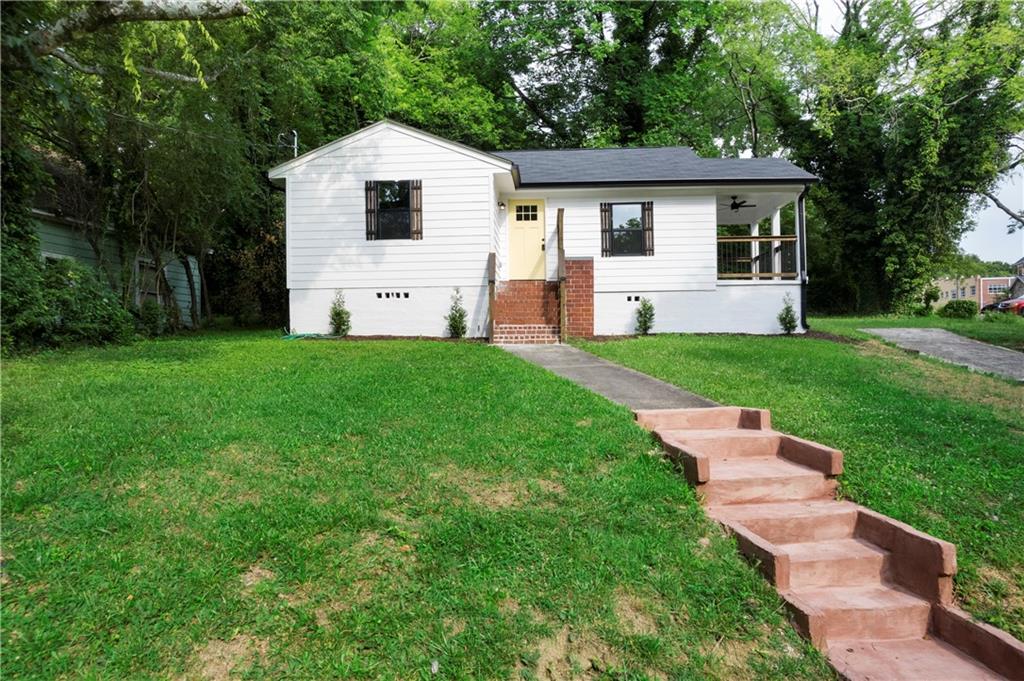 a front view of house with yard and green space