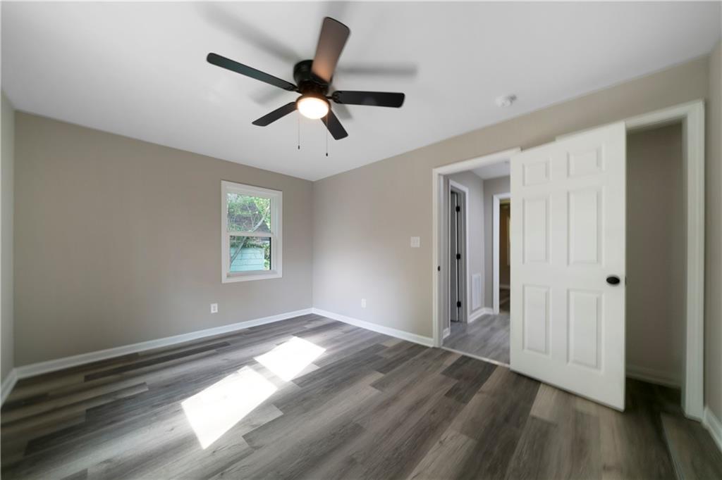 515 Harper Avenue Southwest Rome, GA 30161 - Photo 16 of 17 a view of empty room with wooden floor and fan