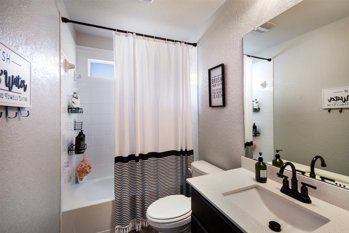 217 Frederick Drive Georgetown, TX 78626 - Photo 19 of 36 a bathroom with a sink toilet and shower