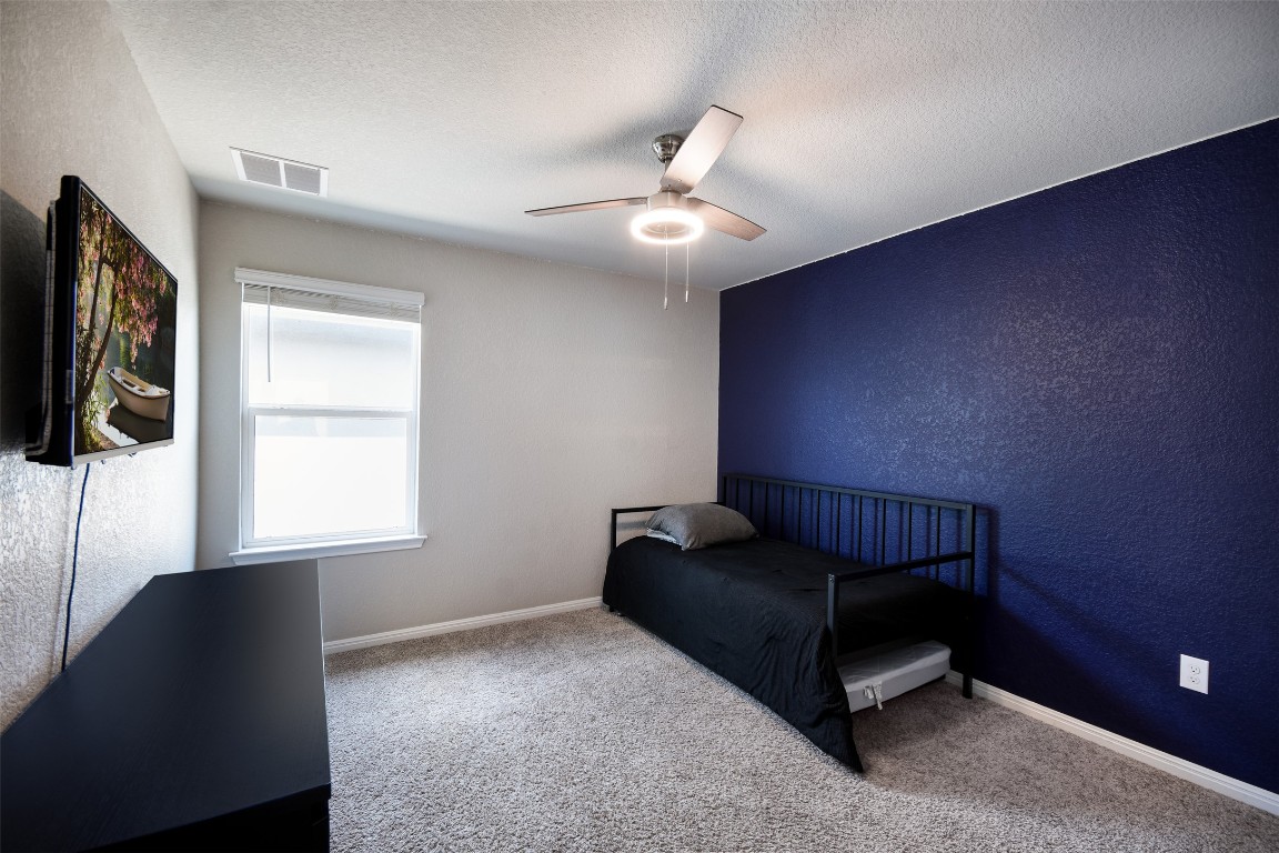 217 Frederick Drive Georgetown, TX 78626 - Photo 21 of 36 a living room with furniture and a window