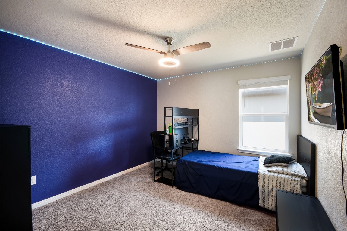 217 Frederick Drive Georgetown, TX 78626 - Photo 22 of 36 a room with furniture and wooden floor