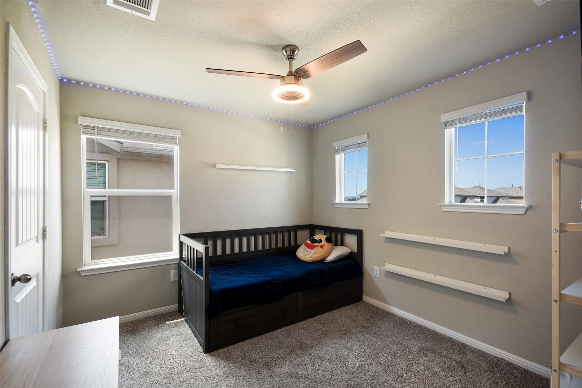 217 Frederick Drive Georgetown, TX 78626 - Photo 26 of 36 a bedroom with furniture and a window