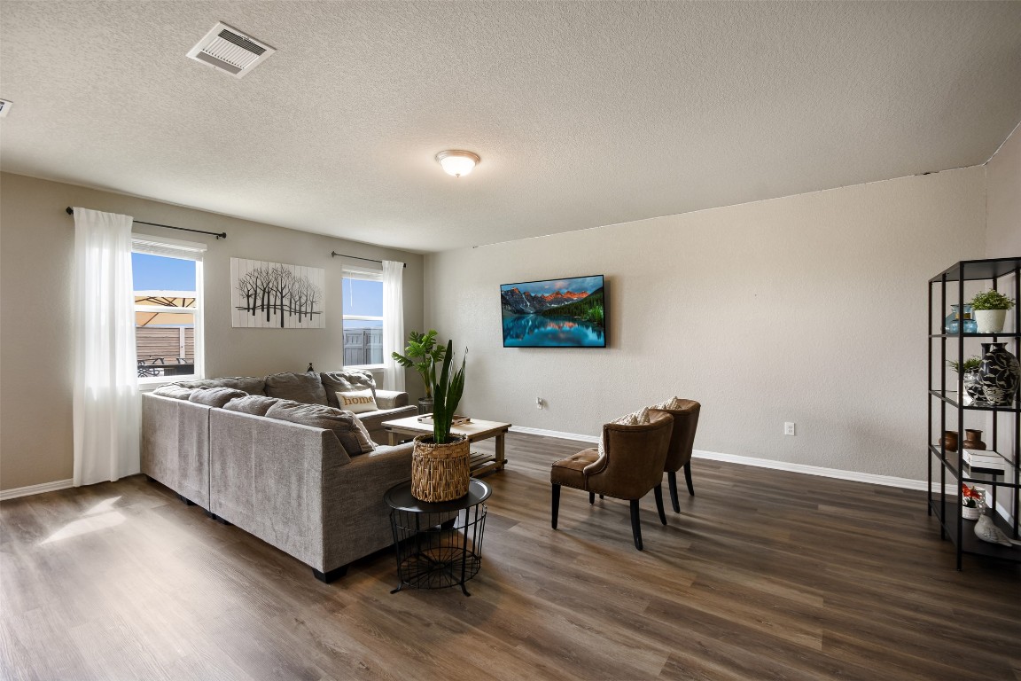 217 Frederick Drive Georgetown, TX 78626 - Photo 5 of 36 a living room with furniture and a wooden floor