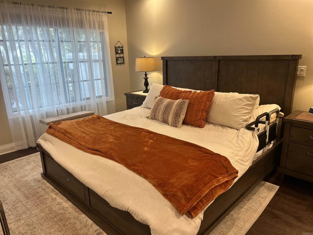 3546 Voyager Circle Carmel Valley, CA 92130 - Photo 16 of 28 a bed sitting in a bedroom next to a window and a walk in closet