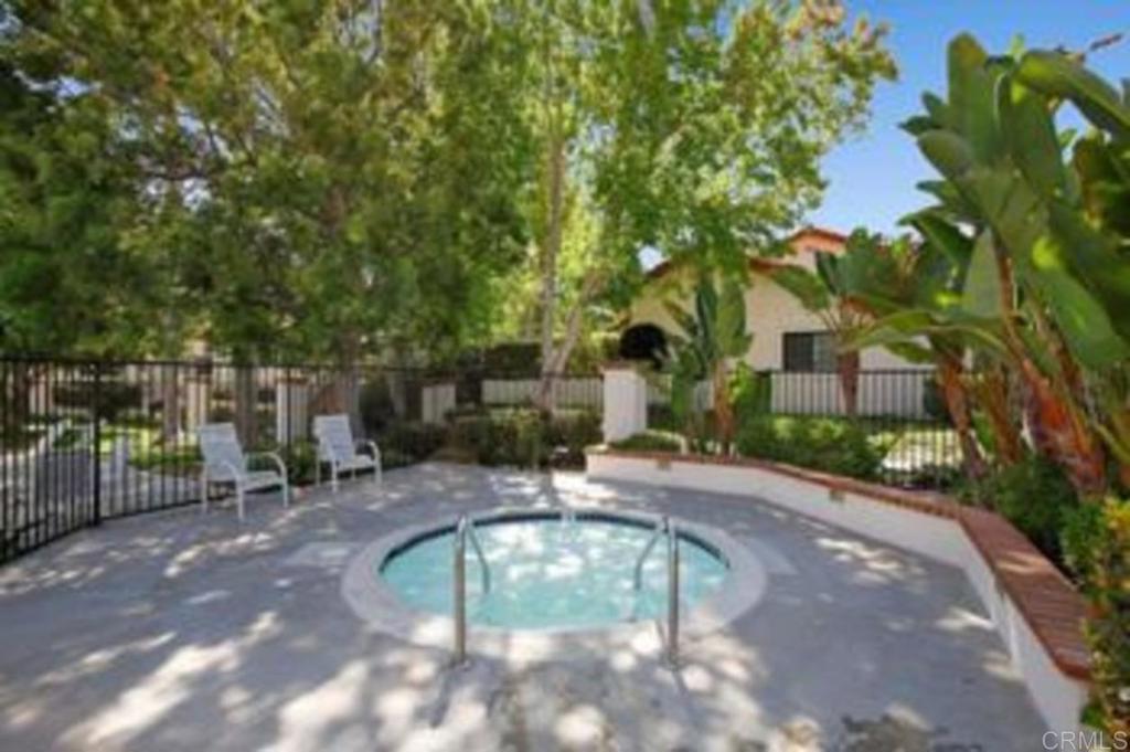 3546 Voyager Circle Carmel Valley, CA 92130 - Photo 23 of 28 a view of a pathway with a wrought fence