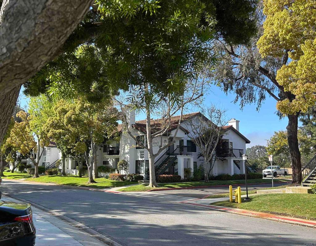 3546 Voyager Circle Carmel Valley, CA 92130 - Photo 28 of 28 a view of a swimming pool and trees in the background