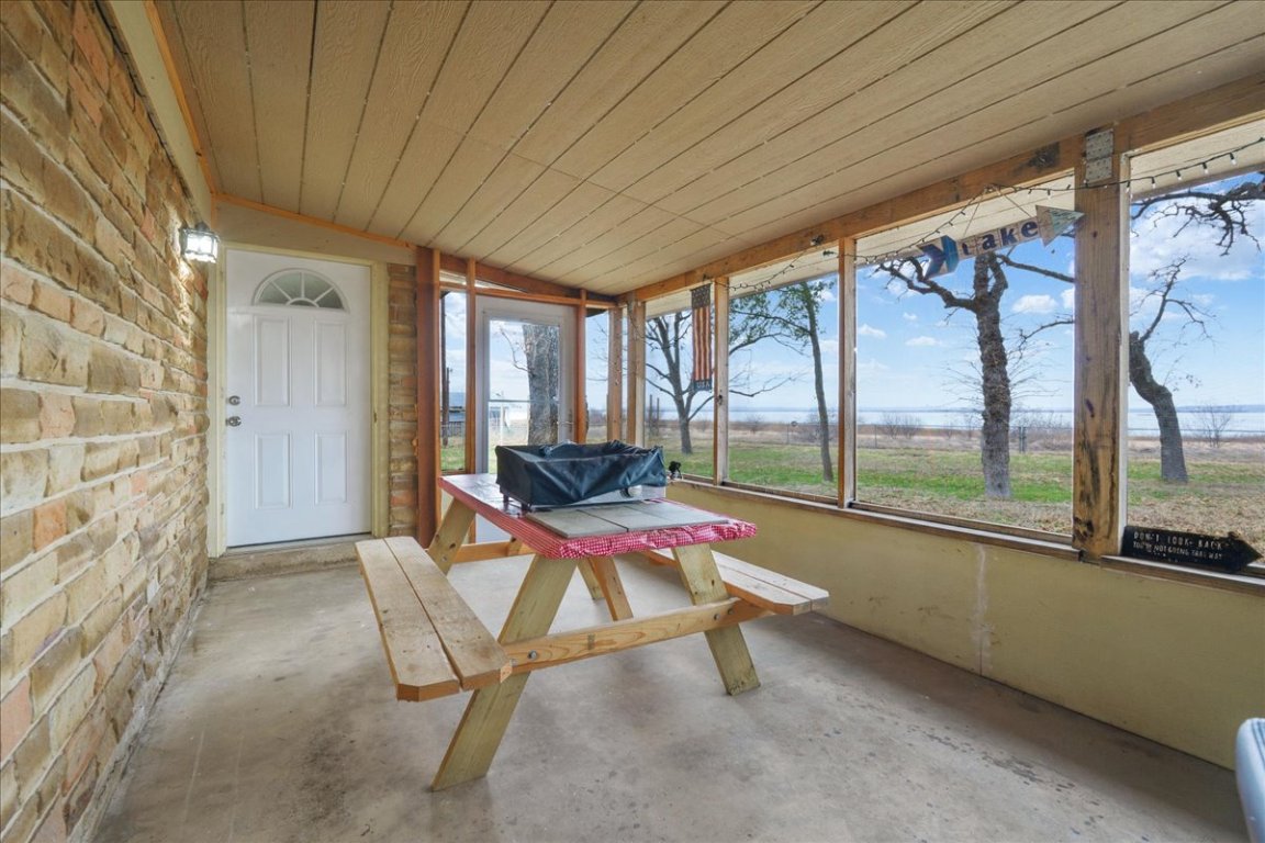 119 Lasso Loop Burnet, TX 78611 - Photo 20 of 35 a room with furniture on wall and a large window