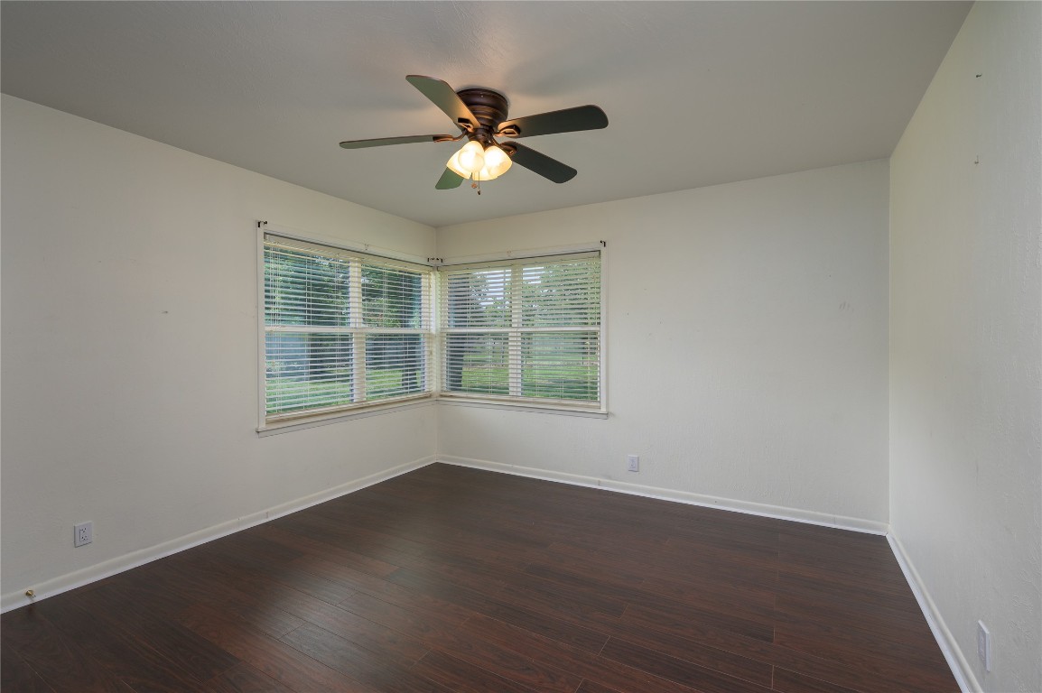 119 Lasso Loop Burnet, TX 78611 - Photo 21 of 35 a view of wooden floor and windows in a room