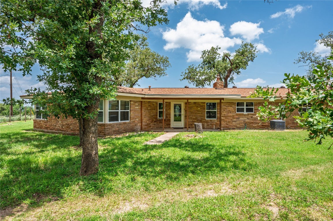 119 Lasso Loop Burnet, TX 78611 - Photo 26 of 35 a front view of house with yard and green space
