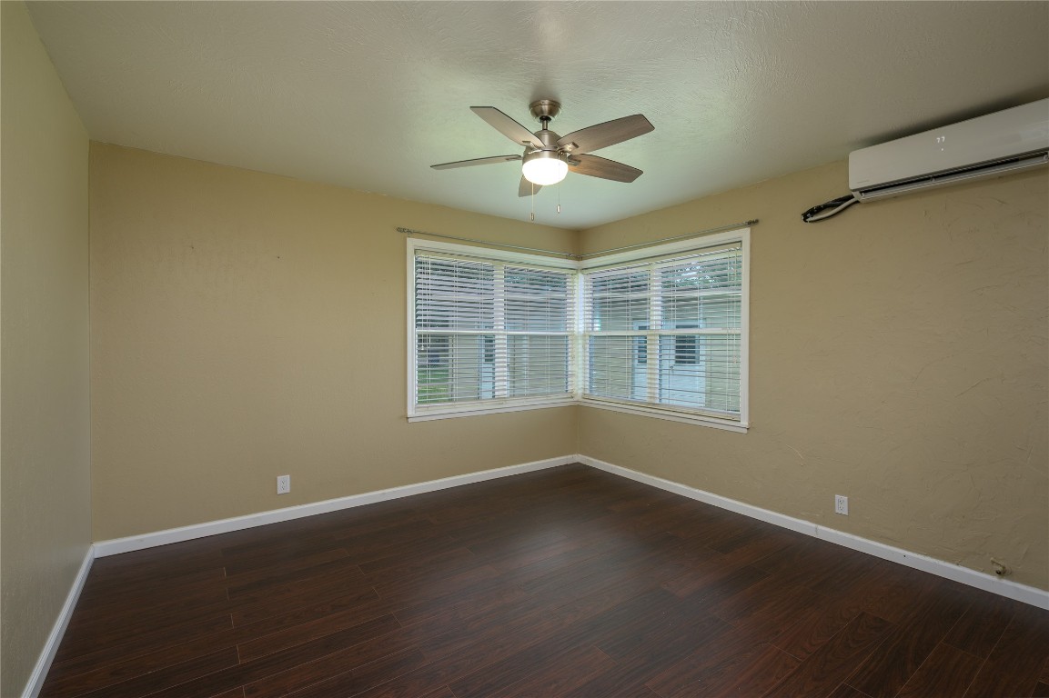 119 Lasso Loop Burnet, TX 78611 - Photo 29 of 35 a view of wooden floor and windows in a room