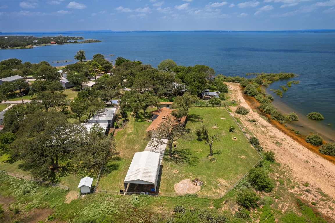 119 Lasso Loop Burnet, TX 78611 - Photo 34 of 35 a aerial view of a house with a yard and lake view