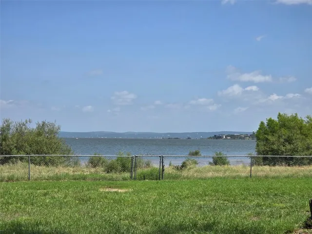 a view of a lake with a big yard