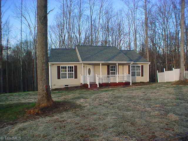 7603 Keating Drive Oak Ridge, NC 27310 - Photo 1 of 6 Exterior Front.