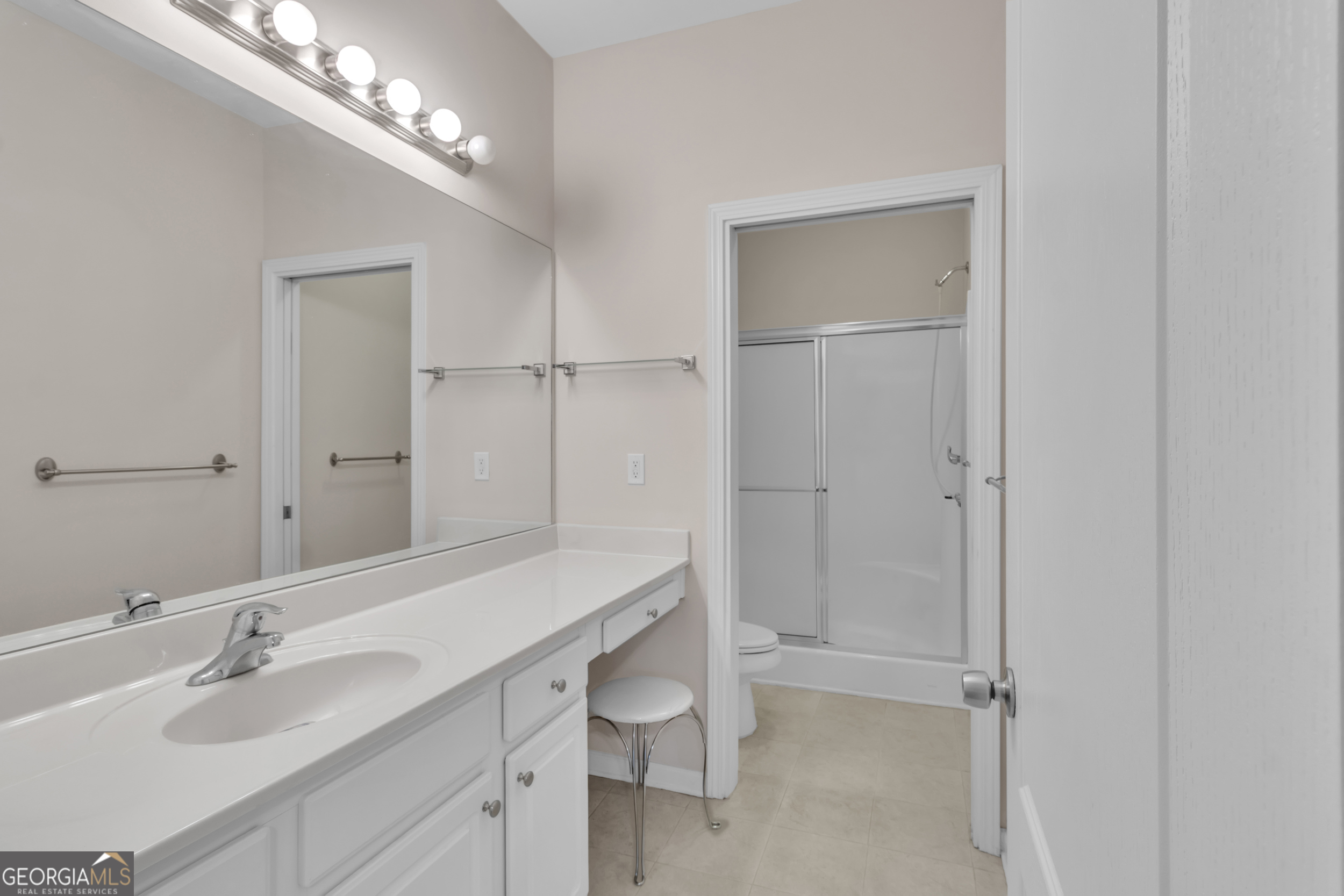 4557 Caleb Crossing, Unit 71 Powder Springs, GA 30127 - Photo 18 of 29 a bathroom with a double vanity sink and a mirror