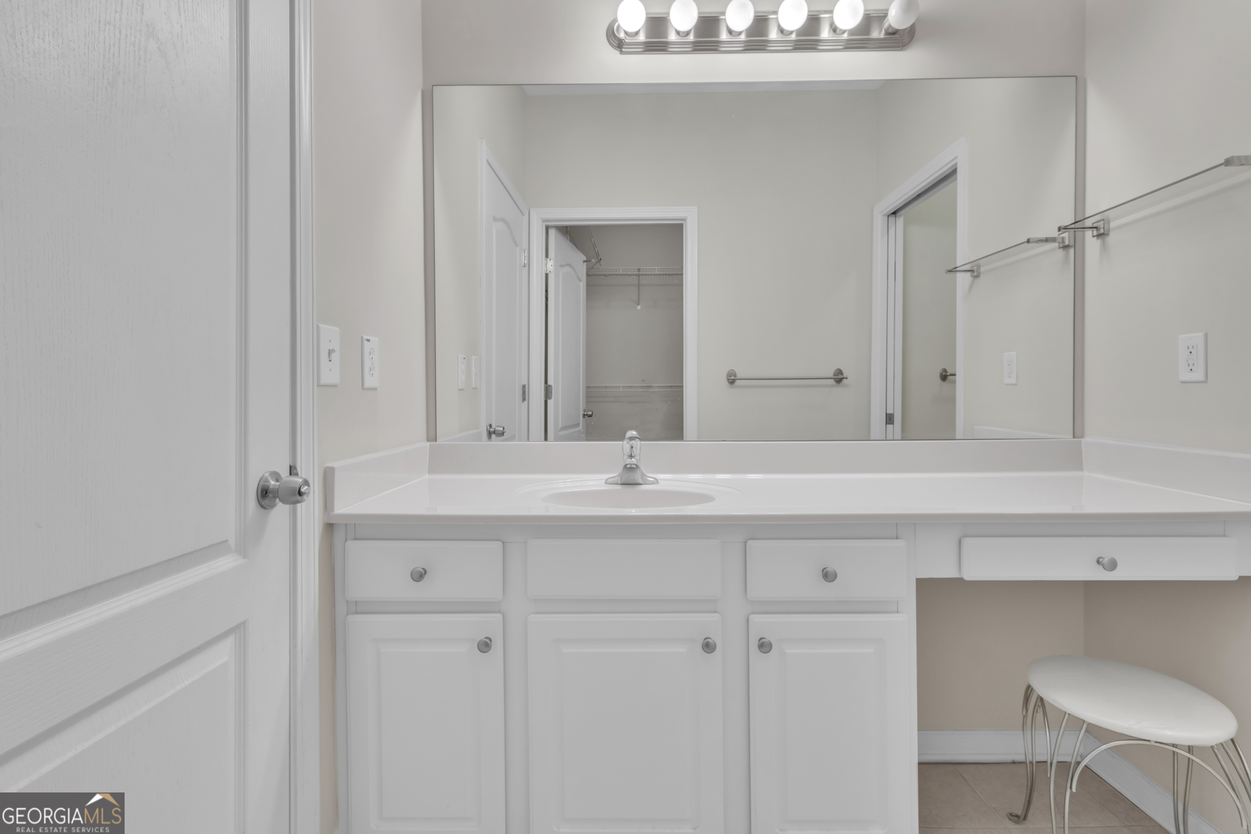 4557 Caleb Crossing, Unit 71 Powder Springs, GA 30127 - Photo 19 of 29 a bathroom with a sink and a mirror