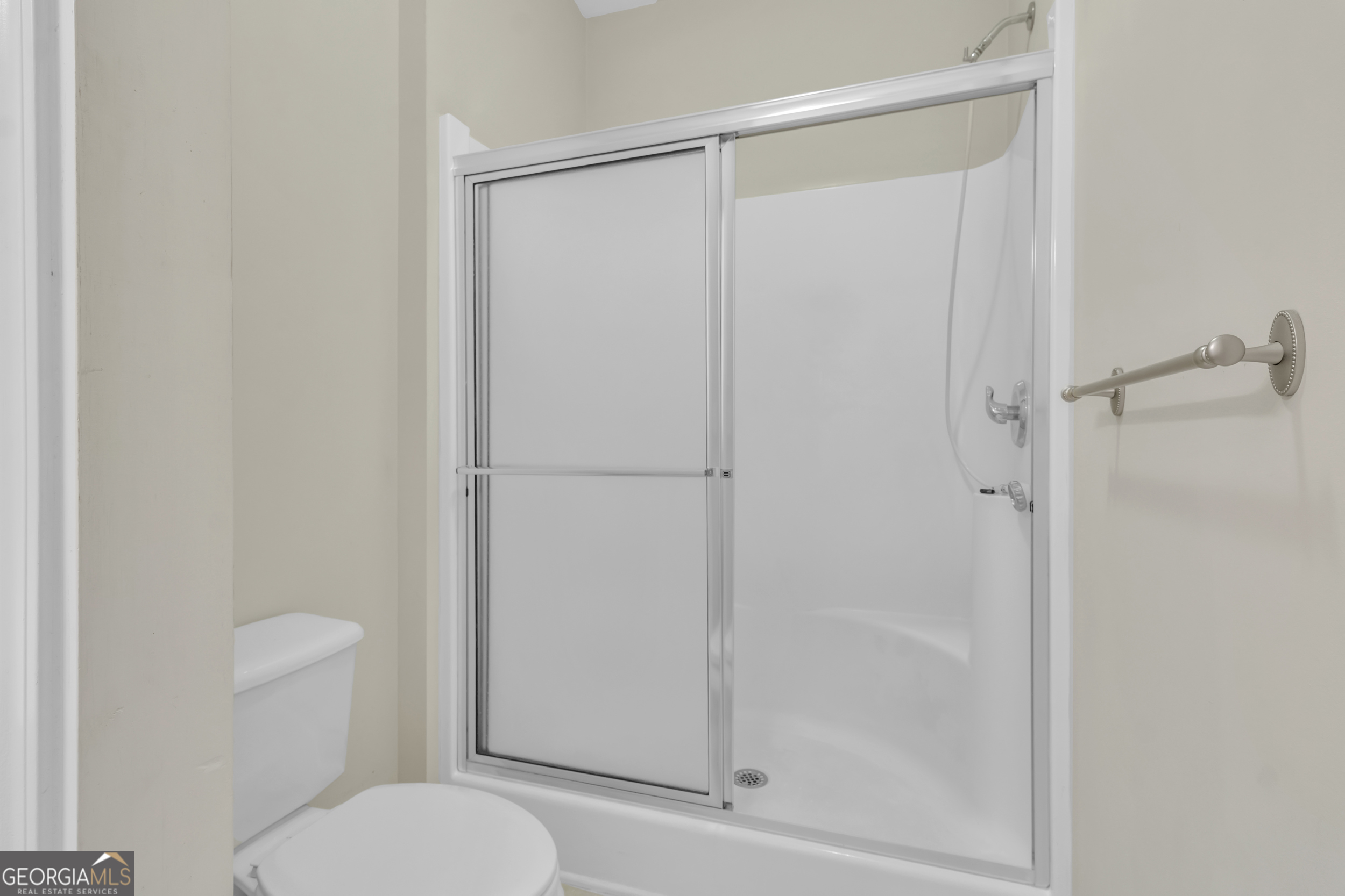 4557 Caleb Crossing, Unit 71 Powder Springs, GA 30127 - Photo 20 of 29 a bathroom with a shower a toilet and a sink