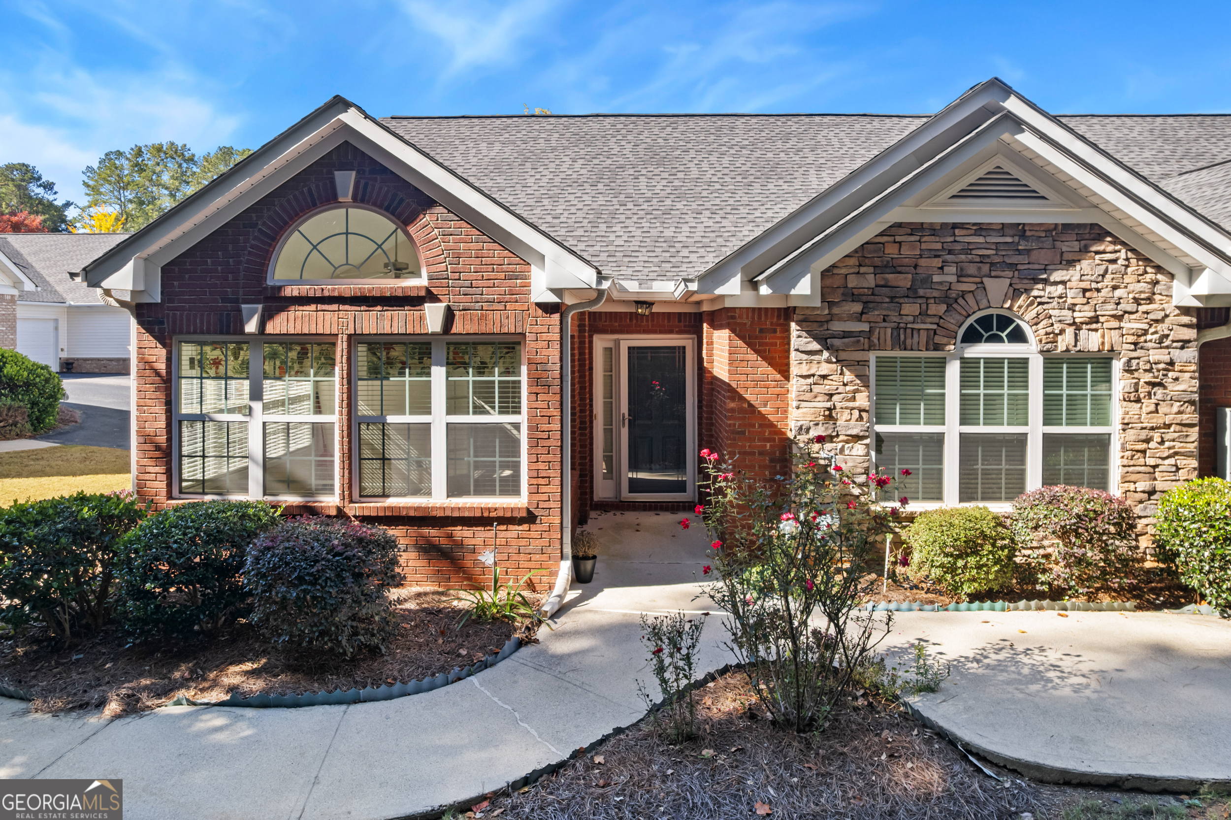 4557 Caleb Crossing, Unit 71 Powder Springs, GA 30127 - Photo 4 of 29 a front view of a house with garden