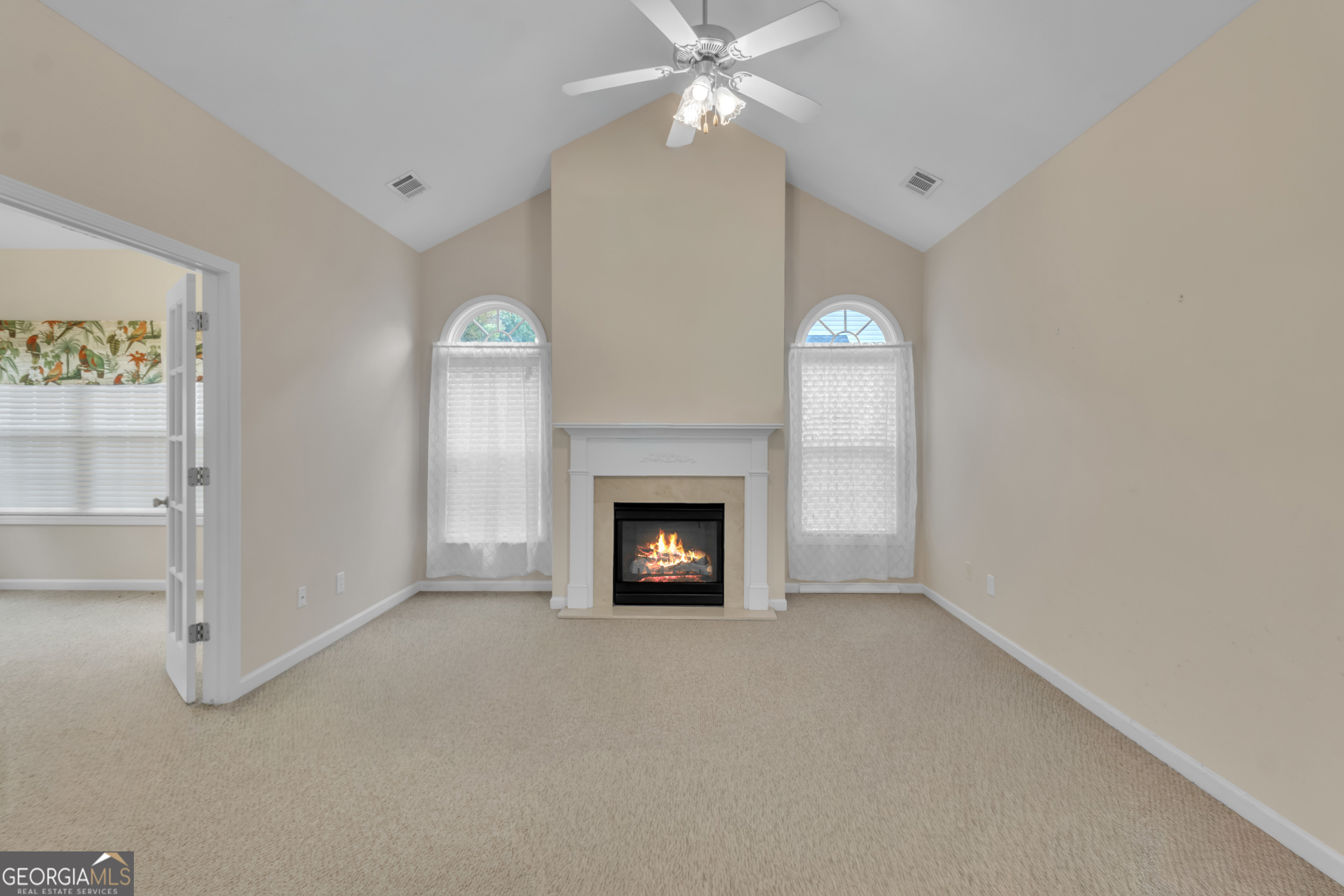 4557 Caleb Crossing, Unit 71 Powder Springs, GA 30127 - Photo 7 of 29 a view of a livingroom with a fireplace and fan