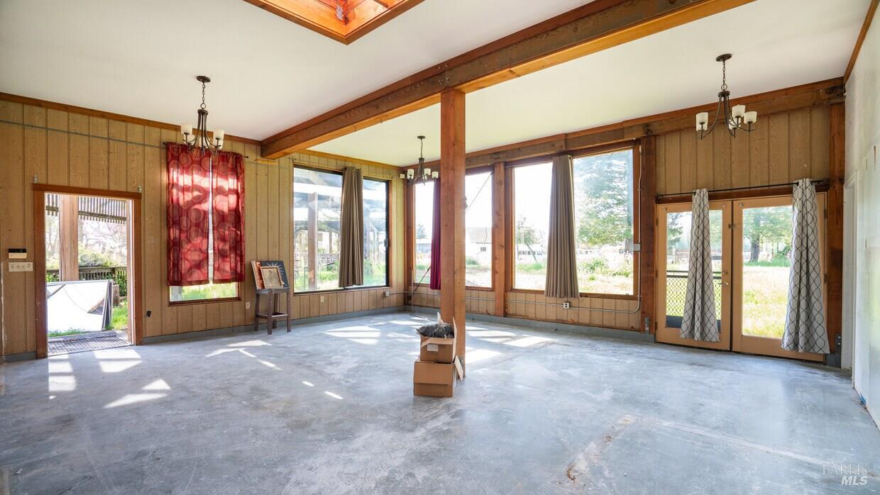 4770 Occidental Road Santa Rosa, CA 95401 - Photo 23 of 30 a living room with large windows and furniture