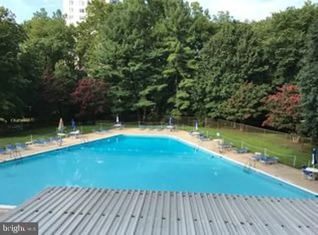a view of a swimming pool with a patio