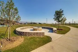 a view of a swimming pool with a patio and yard