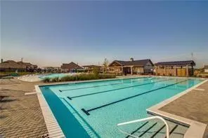 a view of a big house with a big yard