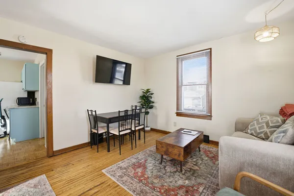 a living room with furniture rug and window