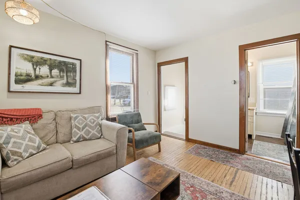 a living room with furniture and a window