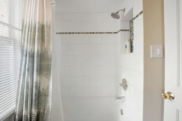 a bathroom with a glass shower door
