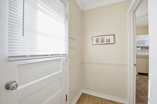 a view of a closet area with an empty room