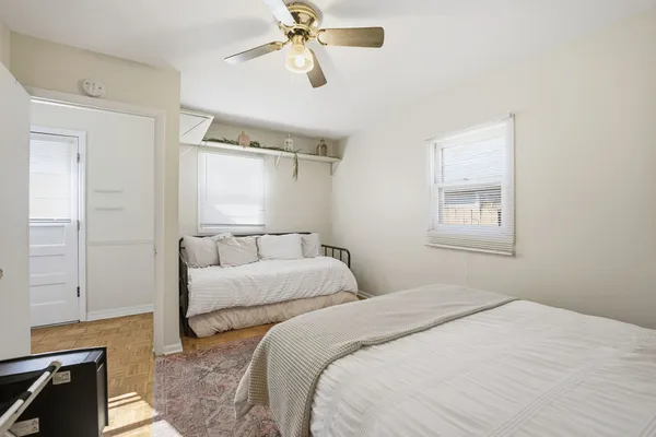 a bedroom with a bed and a window