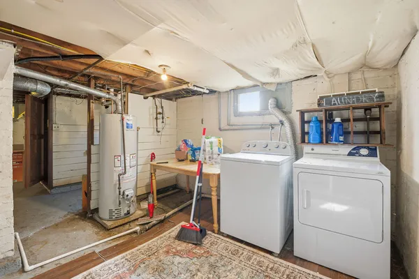 a view of a storage & utility room with washer and dryer