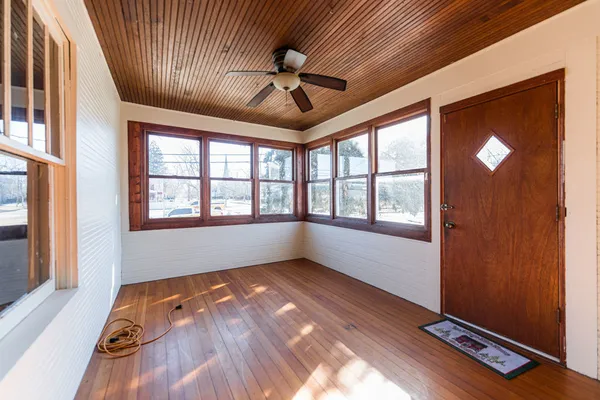 a view of room with window and ceiling fan