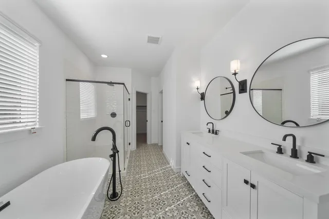 a view of a lake with houses in the back