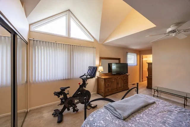 a view of a livingroom with workspace and a window