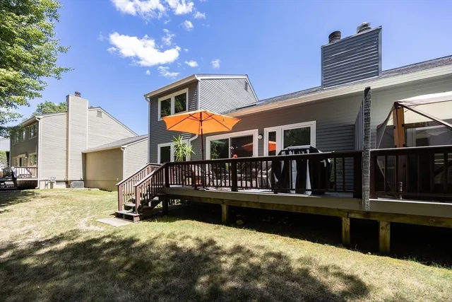a view of a house with swimming pool and sitting area